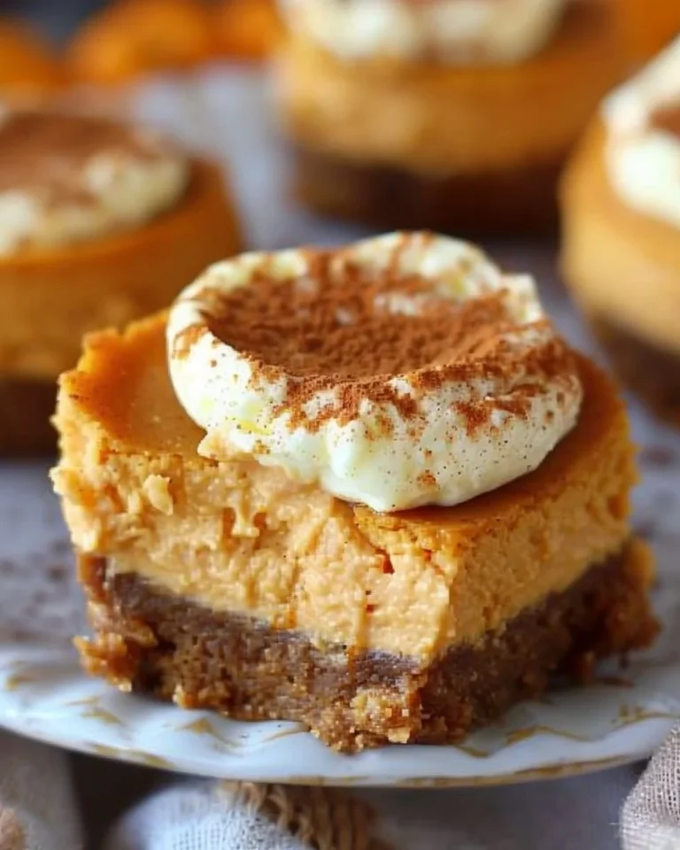 Delicious mini pumpkin cheesecakes topped with whipped cream