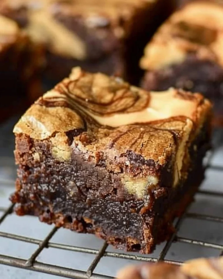 Delicious Peanut Butter Swirl Brownies topped with creamy peanut butter